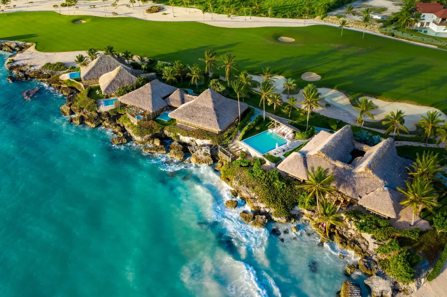 Aerial view of oceanfront bungalows and private pools at Eden Roc Cap Cana.