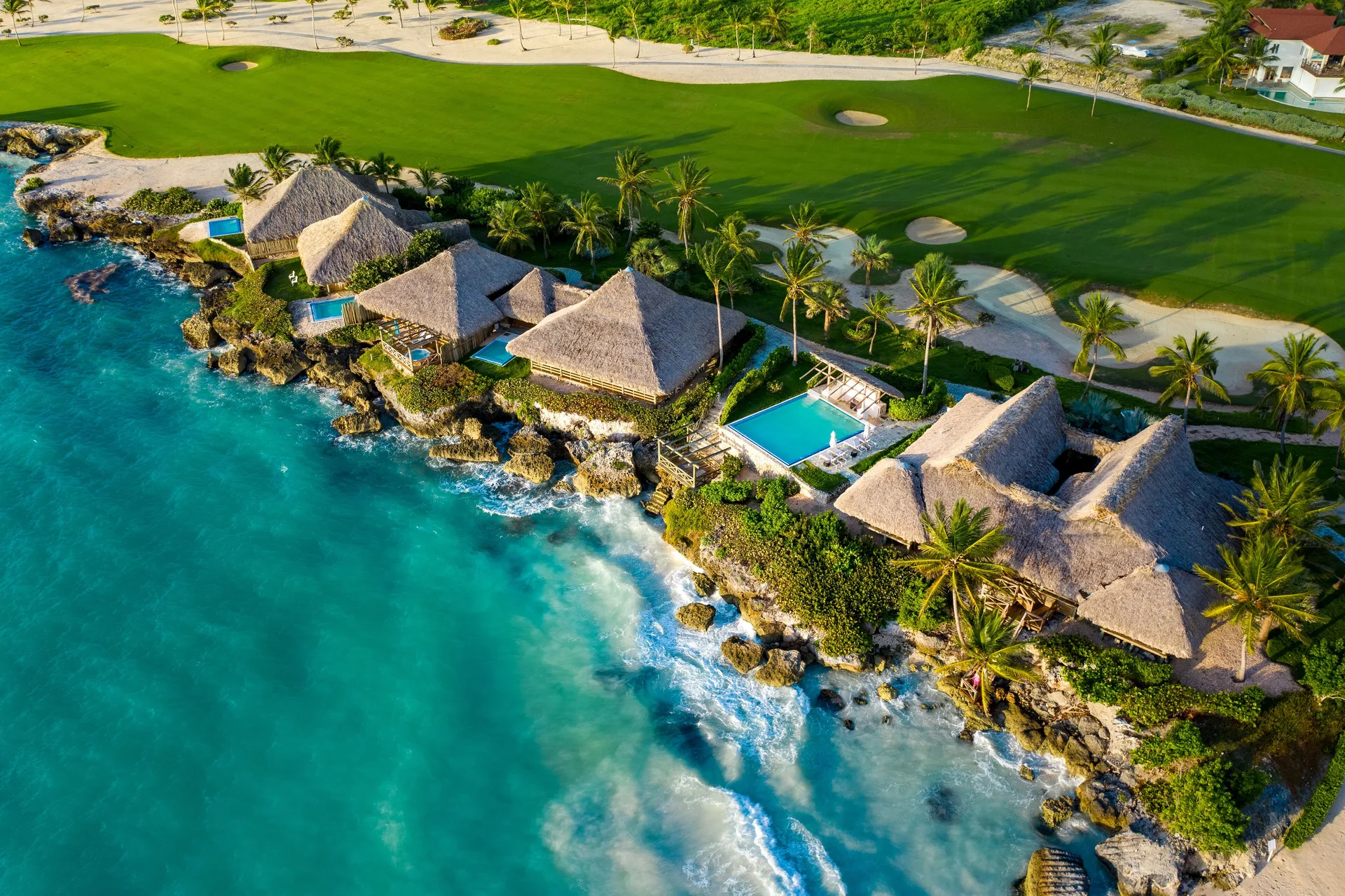 Aerial view of oceanfront bungalows and private pools at Eden Roc Cap Cana.