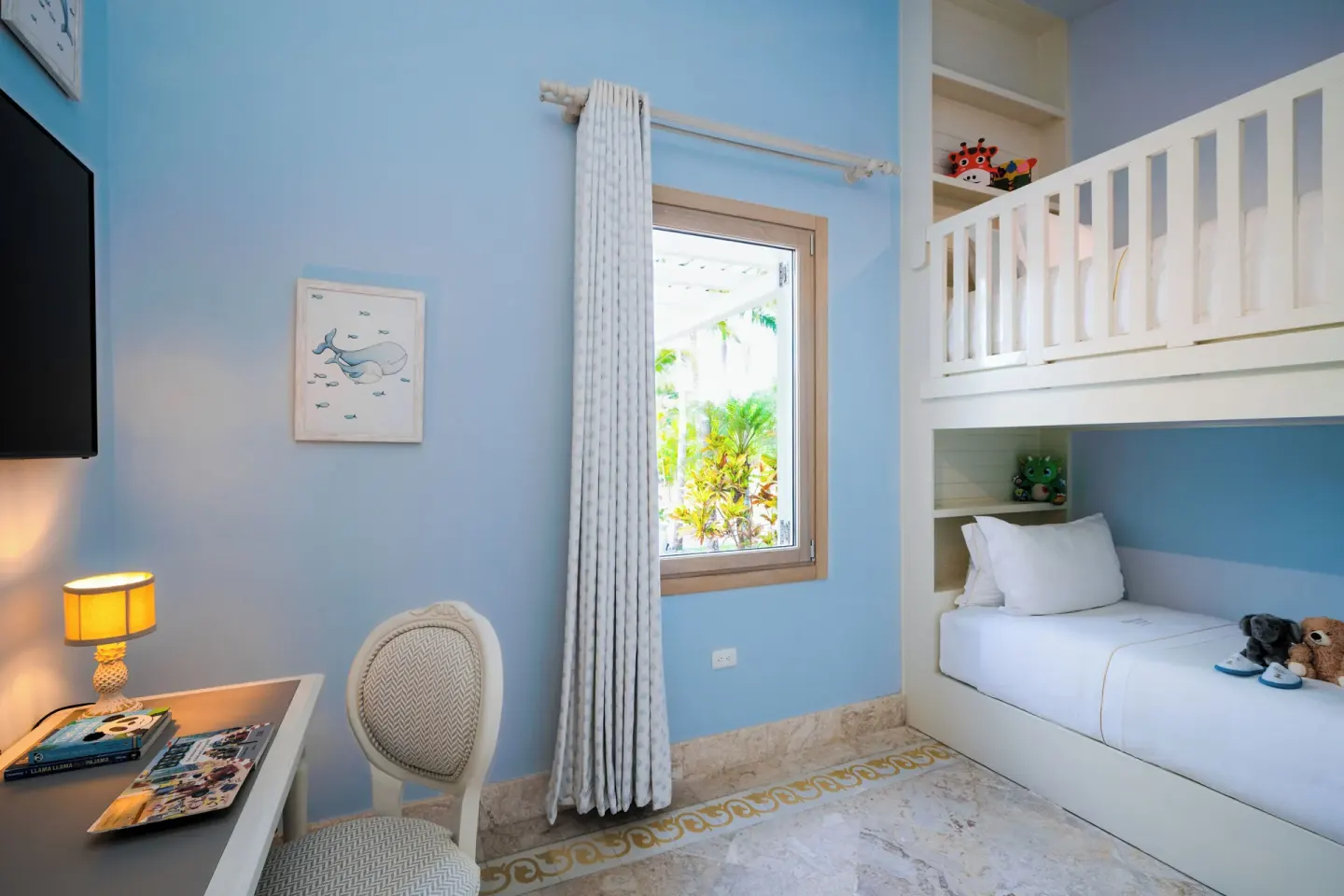 Blue children’s bunk room in a Luxury Pool Family Suite at Eden Roc Cap Cana.