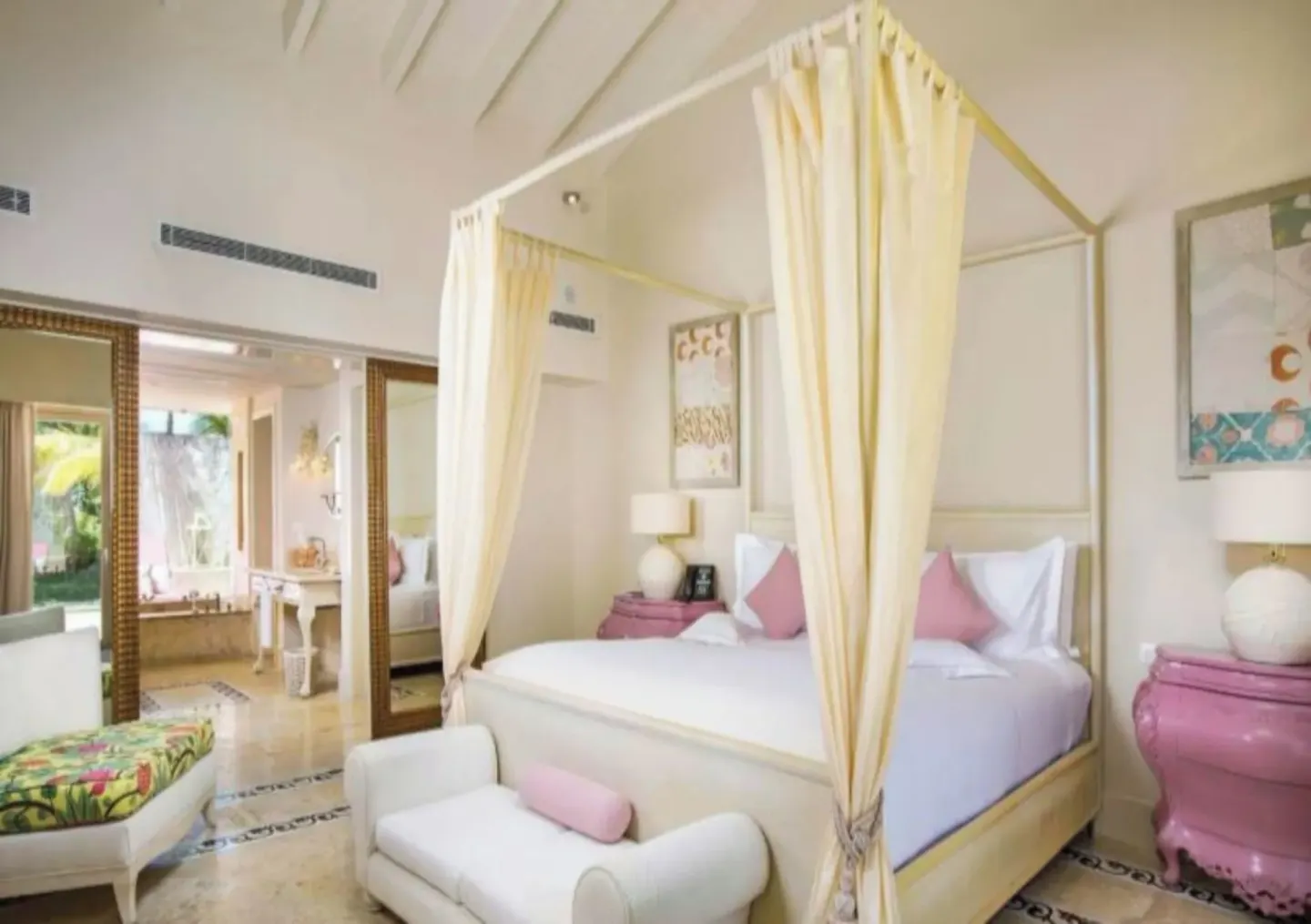 Canopy king bed in a Luxury Pool Family Suite bedroom at Eden Roc Cap Cana.