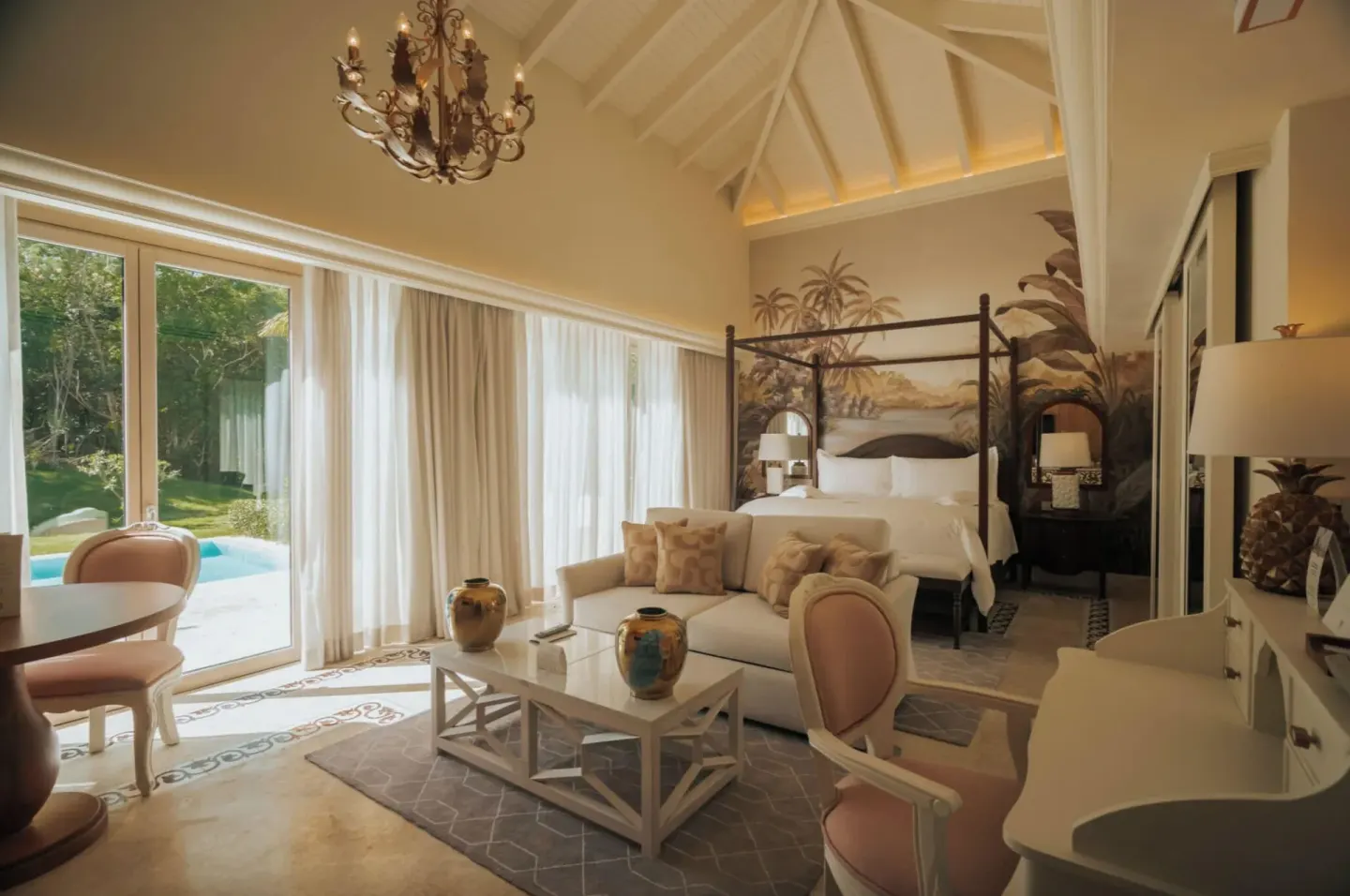 Luxury Pool Junior Suite with king bed, lounge area, and pool doors at Eden Roc Cap Cana.
