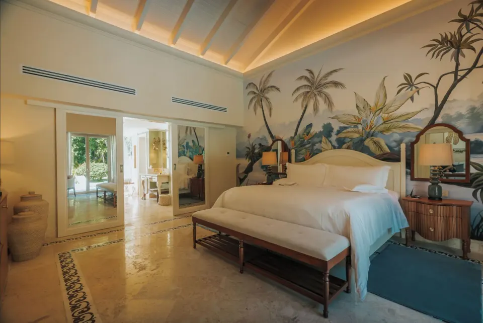 Luxury Pool One Bedroom Suite king bed with tropical mural at Eden Roc Cap Cana.