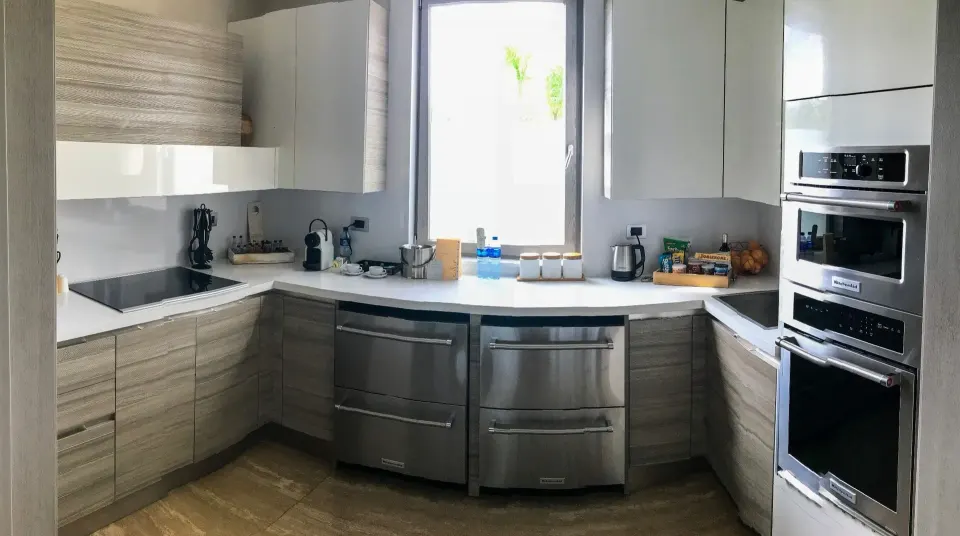 Beachfront one-bedroom suite kitchen with built-in appliances at Eden Roc Cap Cana.
