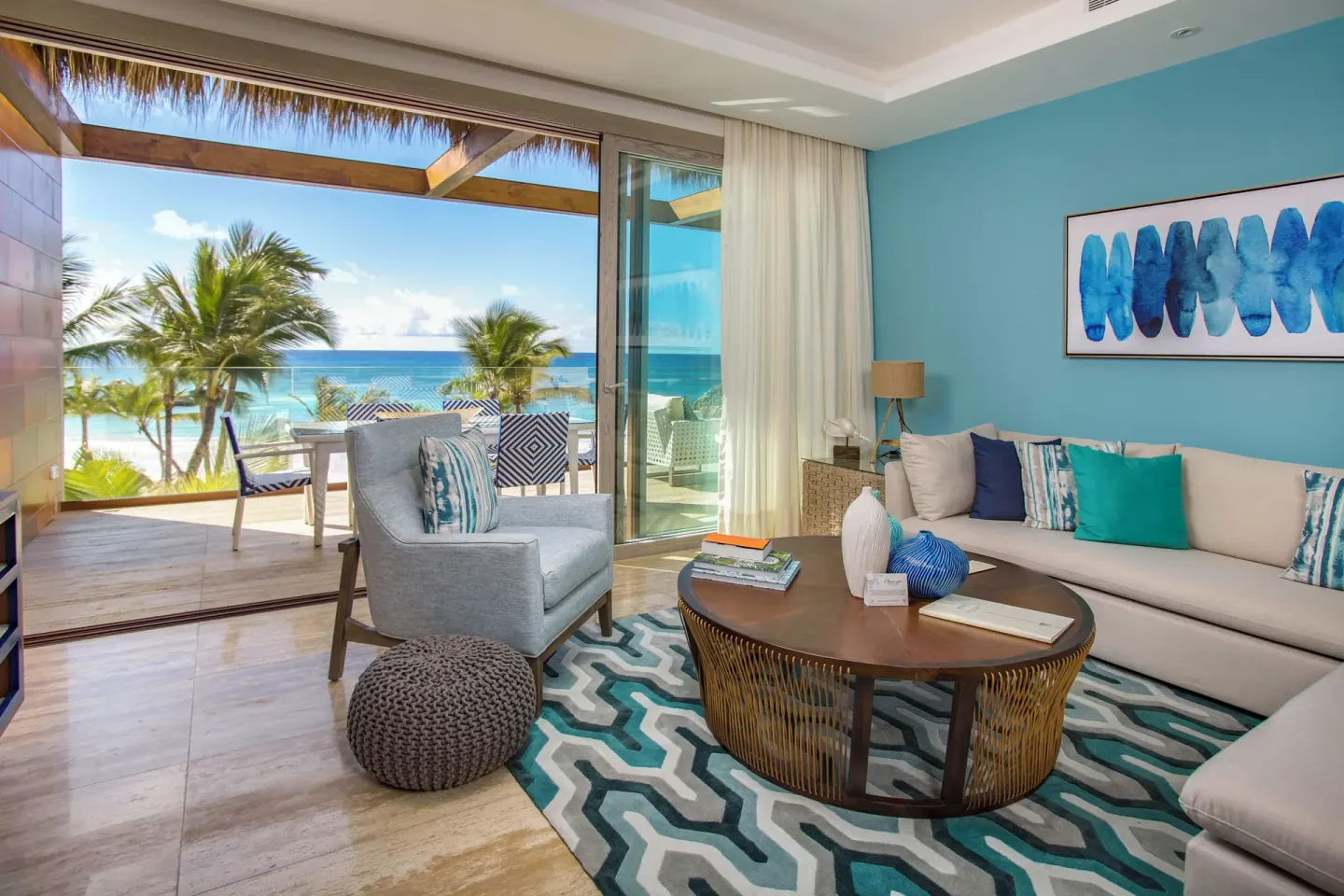 Beachfront one-bedroom suite living room and terrace at Eden Roc Cap Cana.