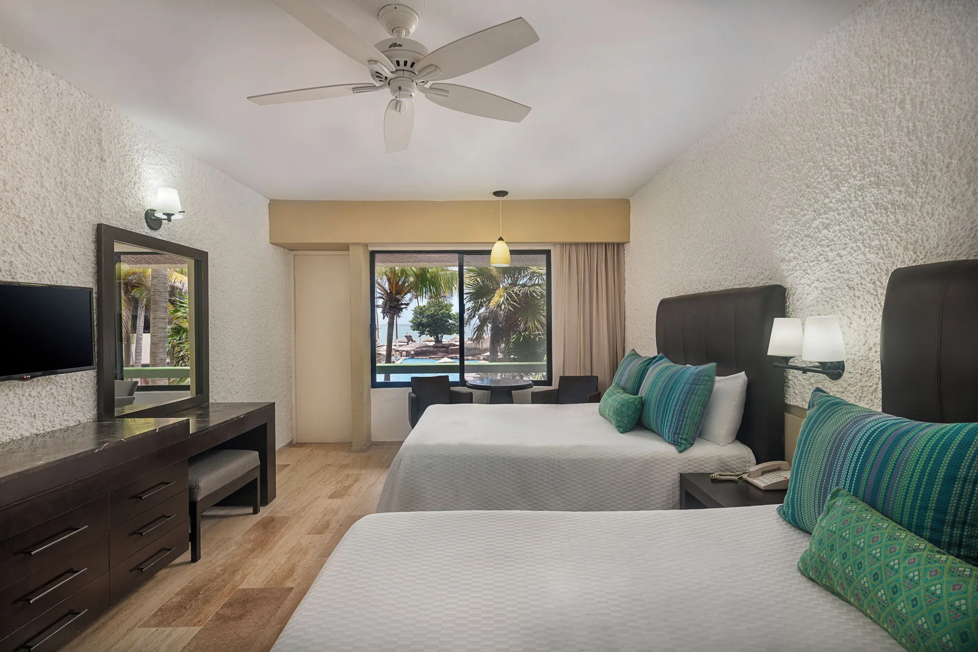 Standard Pool View room with two beds and window at El Cid Castilla Beach Hotel.