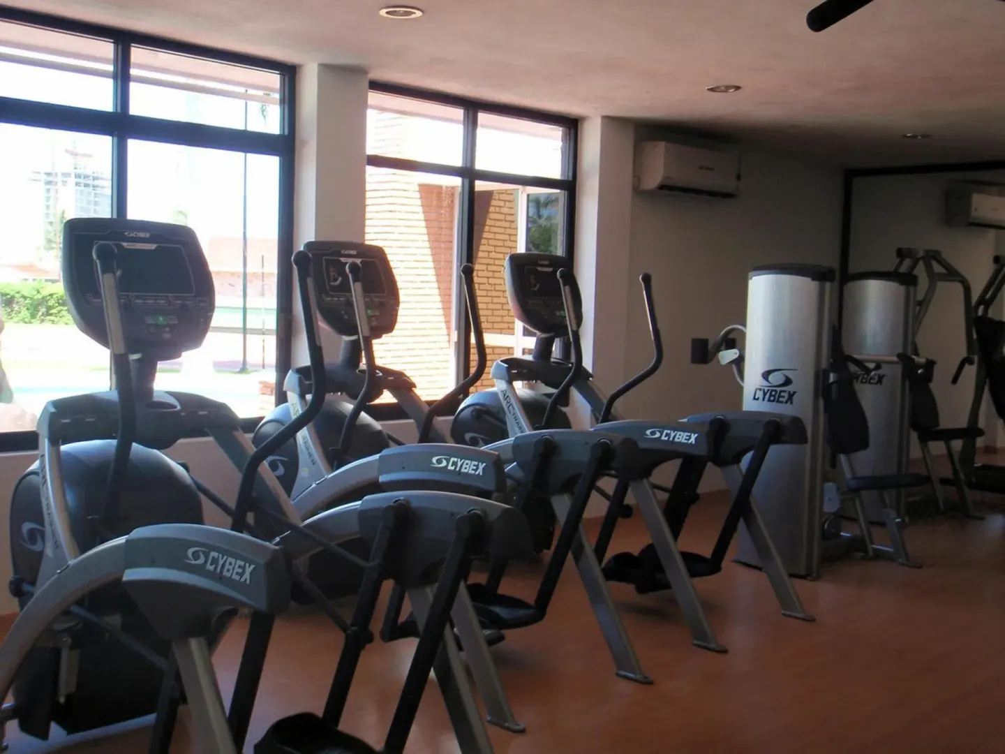 Fitness room with cardio machines and weight equipment at El Cid Granada Hotel.