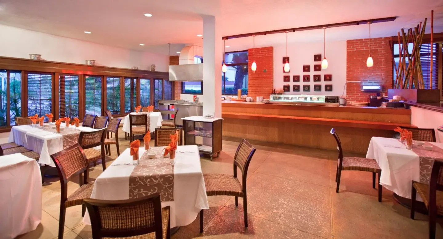 Sushi bar dining room with set tables at El Cid Granada Hotel.