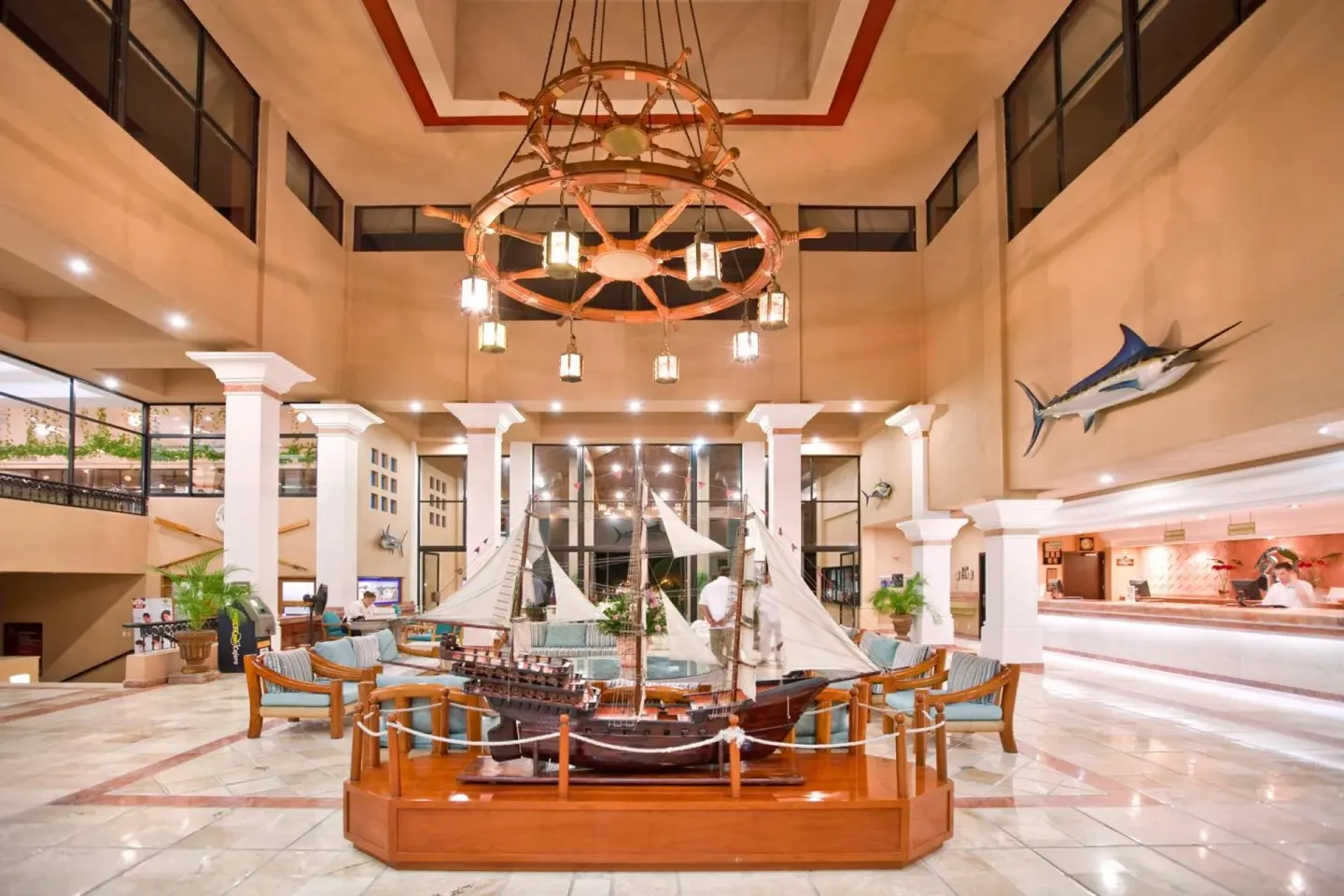 Marina-themed lobby with ship model at El Cid Marina Beach Hotel.