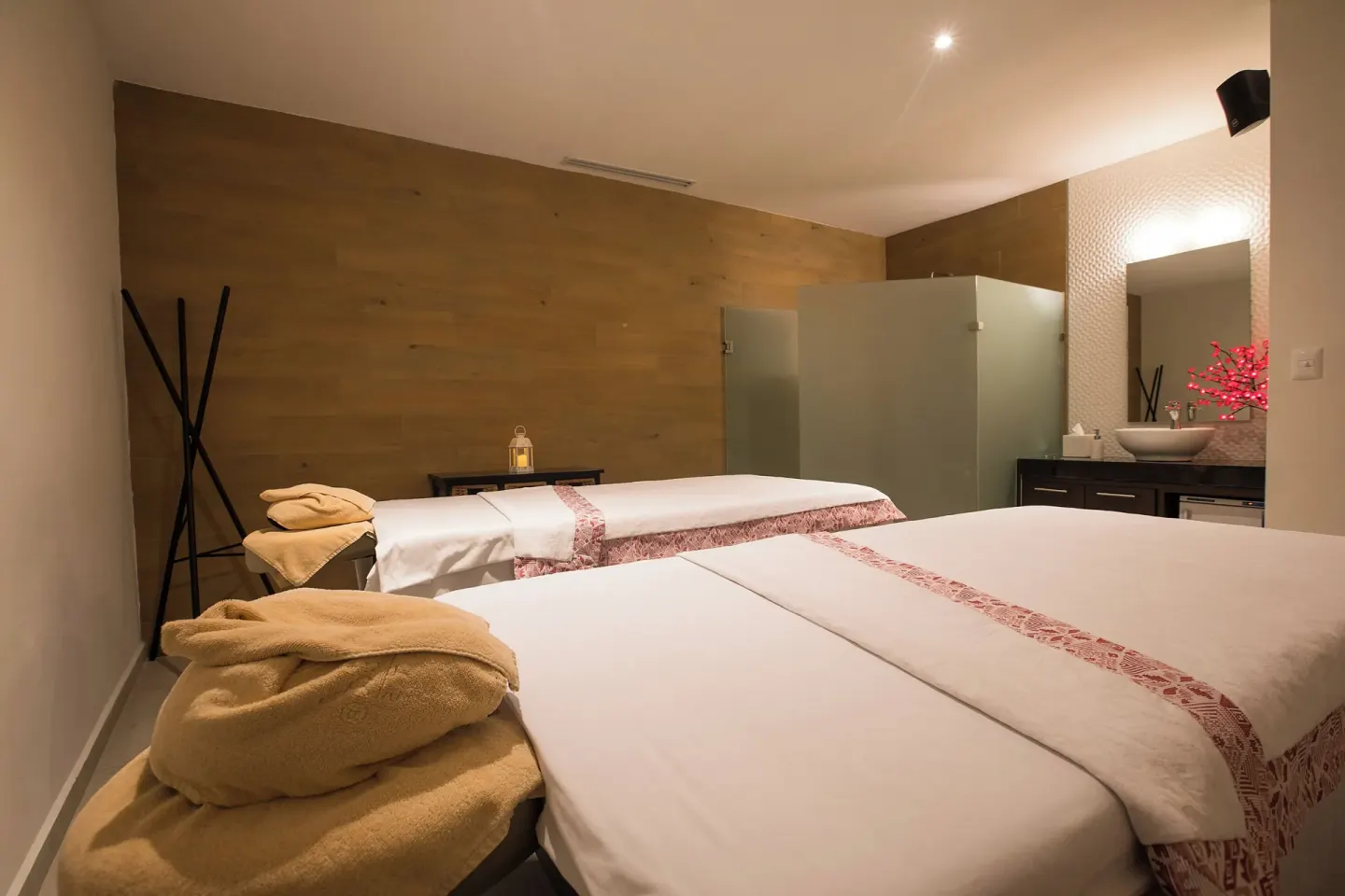 Spa treatment room with two massage tables at El Cid Marina Beach Hotel.