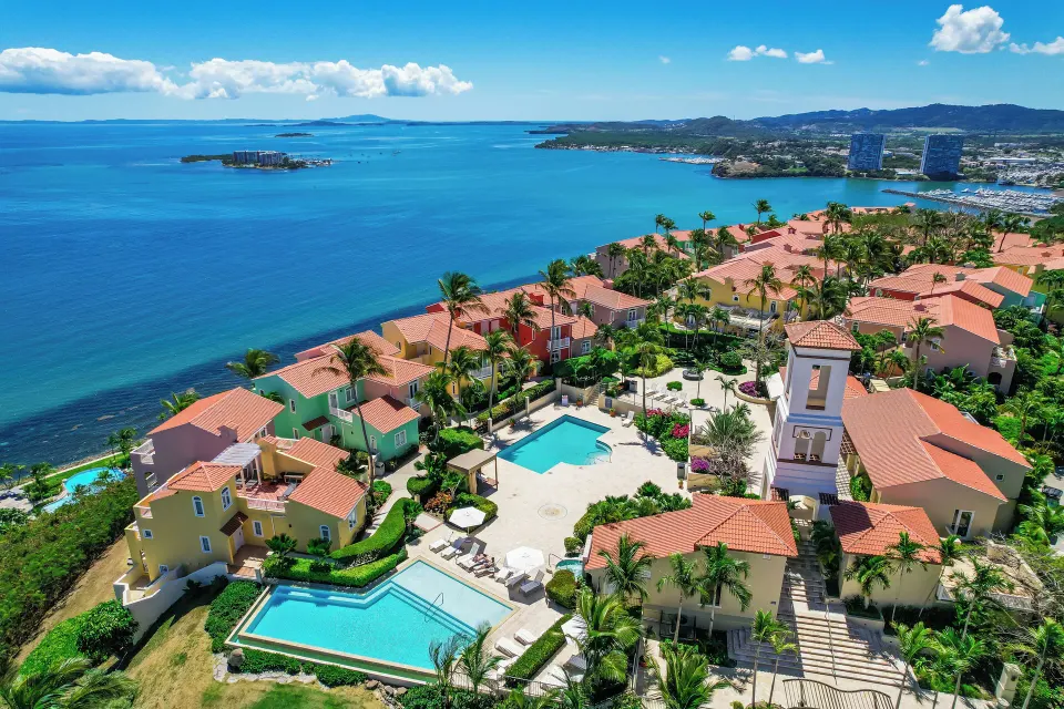 Hillside villas and pools overlooking the bay at El Conquistador Resort.