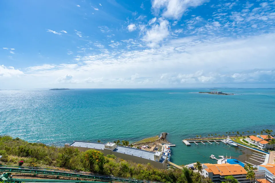 Elevated ocean, marina, and coastline view from El Conquistador Resort.