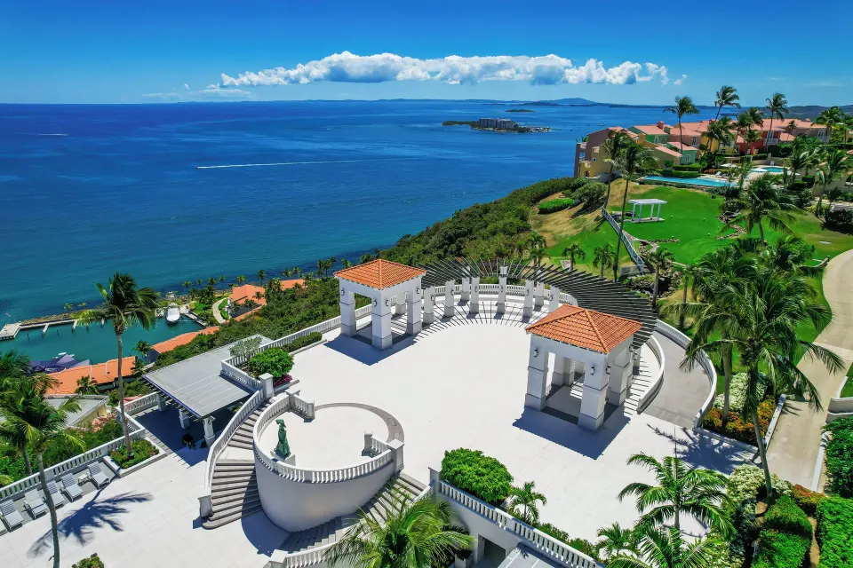 Ocean-view terrace and lawn above the coast at El Conquistador Resort.
