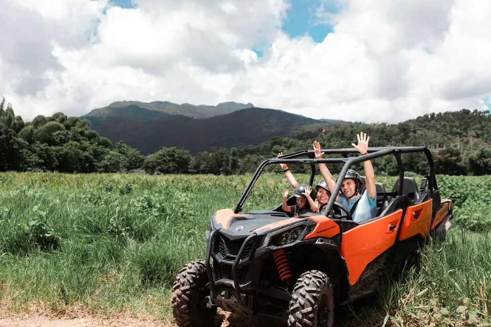 Guests ride an off-road buggy near mountain scenery at El Conquistador Resort.