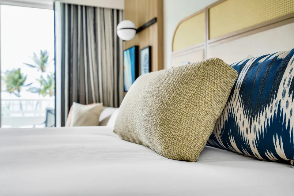 Close-up of pillows on a Deluxe Marina View Room bed at El Conquistador Resort.