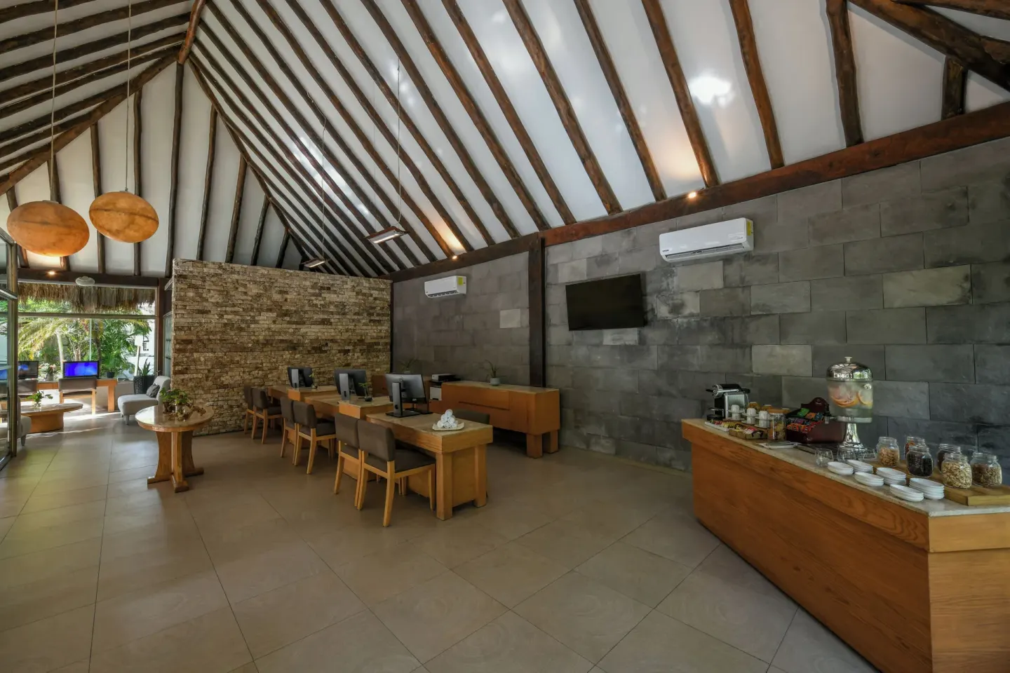 Computer lounge with refreshments in a thatched-roof building at El Dorado Casitas Royale.