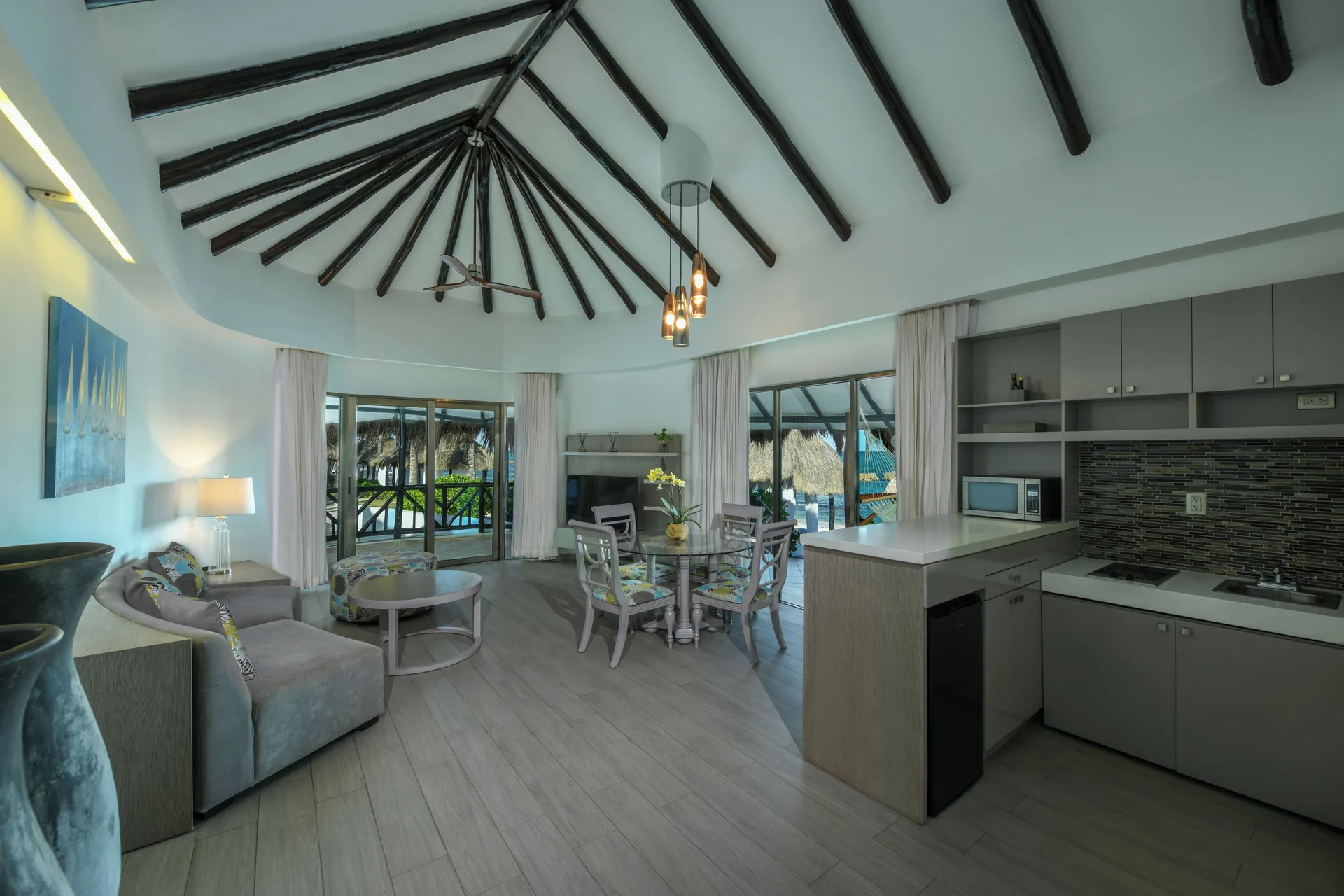 Guest suite living area with kitchenette and terrace doors at El Dorado Casitas Royale.