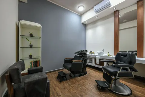 Barbershop-style salon room with grooming chairs at El Dorado Casitas Royale.