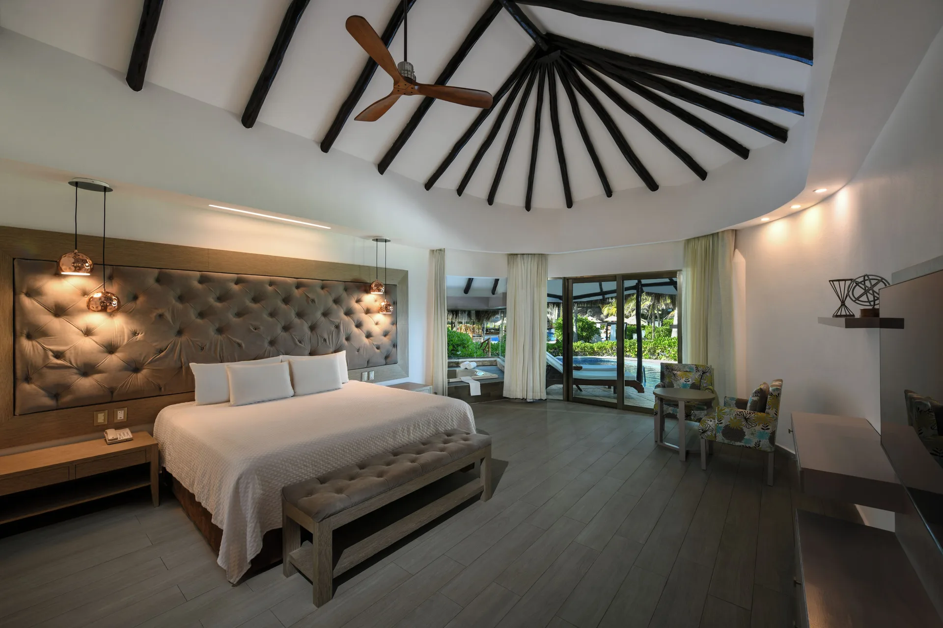 Spacious king-bed guest room with vaulted ceiling at El Dorado Casitas Royale.