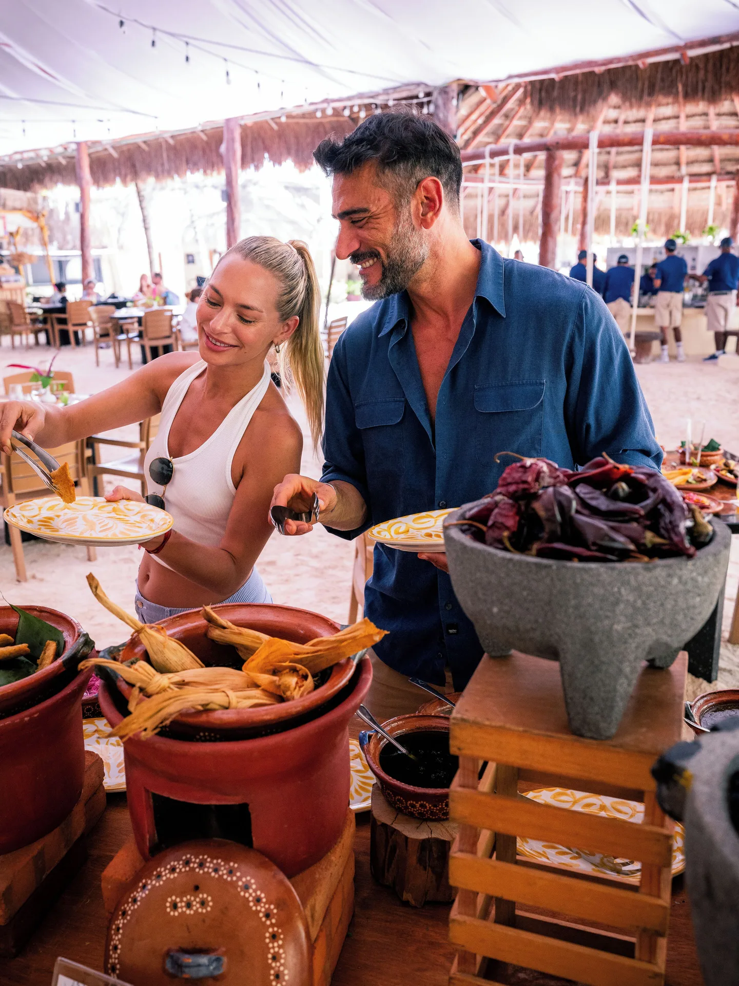 Guests serve themselves from a Mexican-style buffet at El Dorado Casitas Royale.