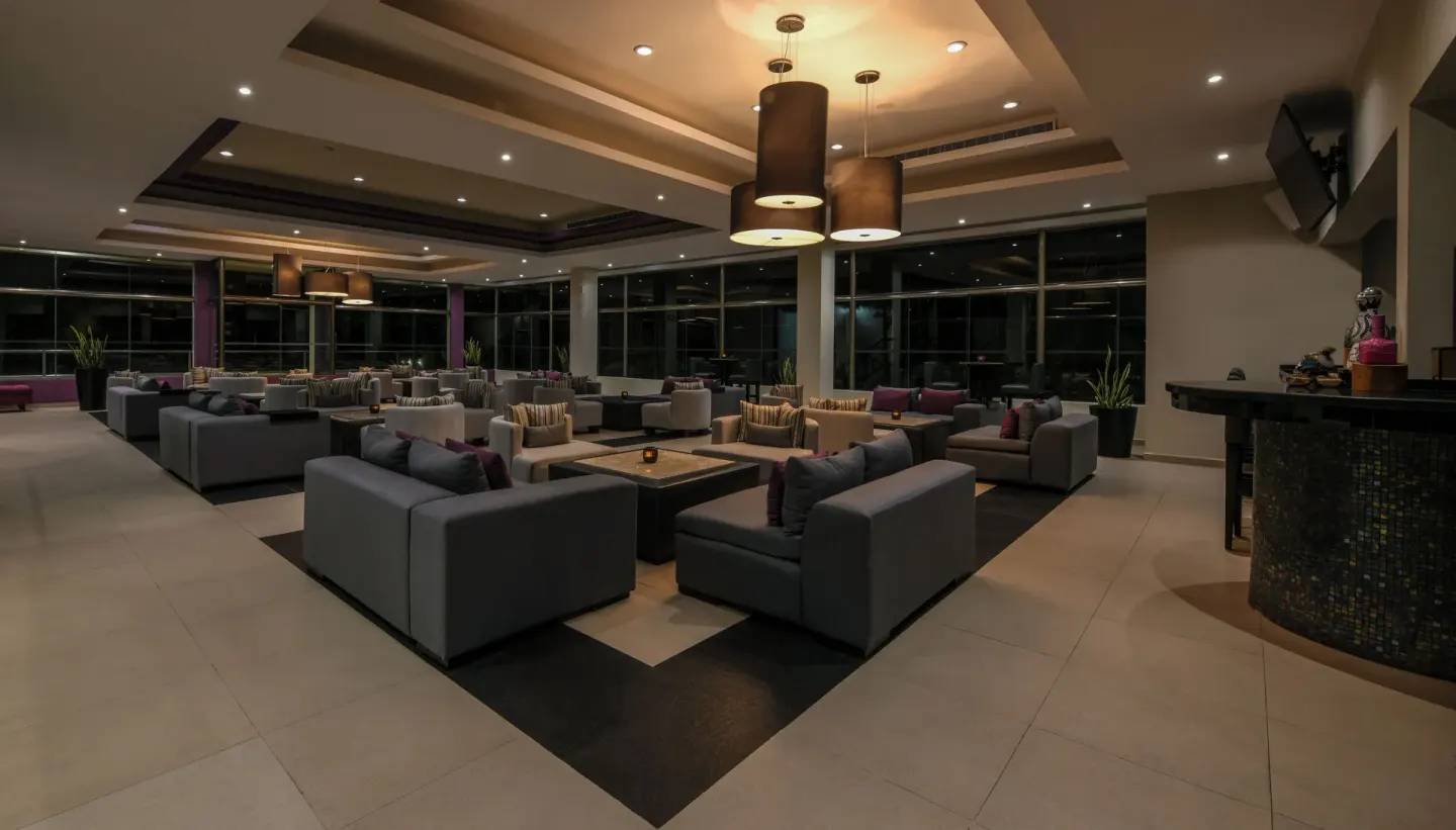 Modern lounge seating area with low tables and pendant lights at El Dorado Casitas Royale.