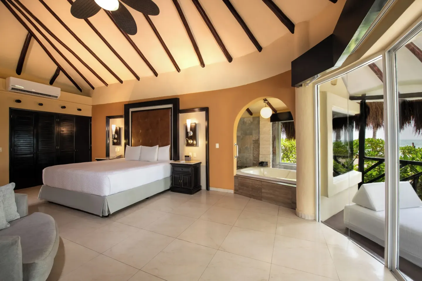 Beachfront Casita Suite king bed and indoor tub at El Dorado Casitas Royale.