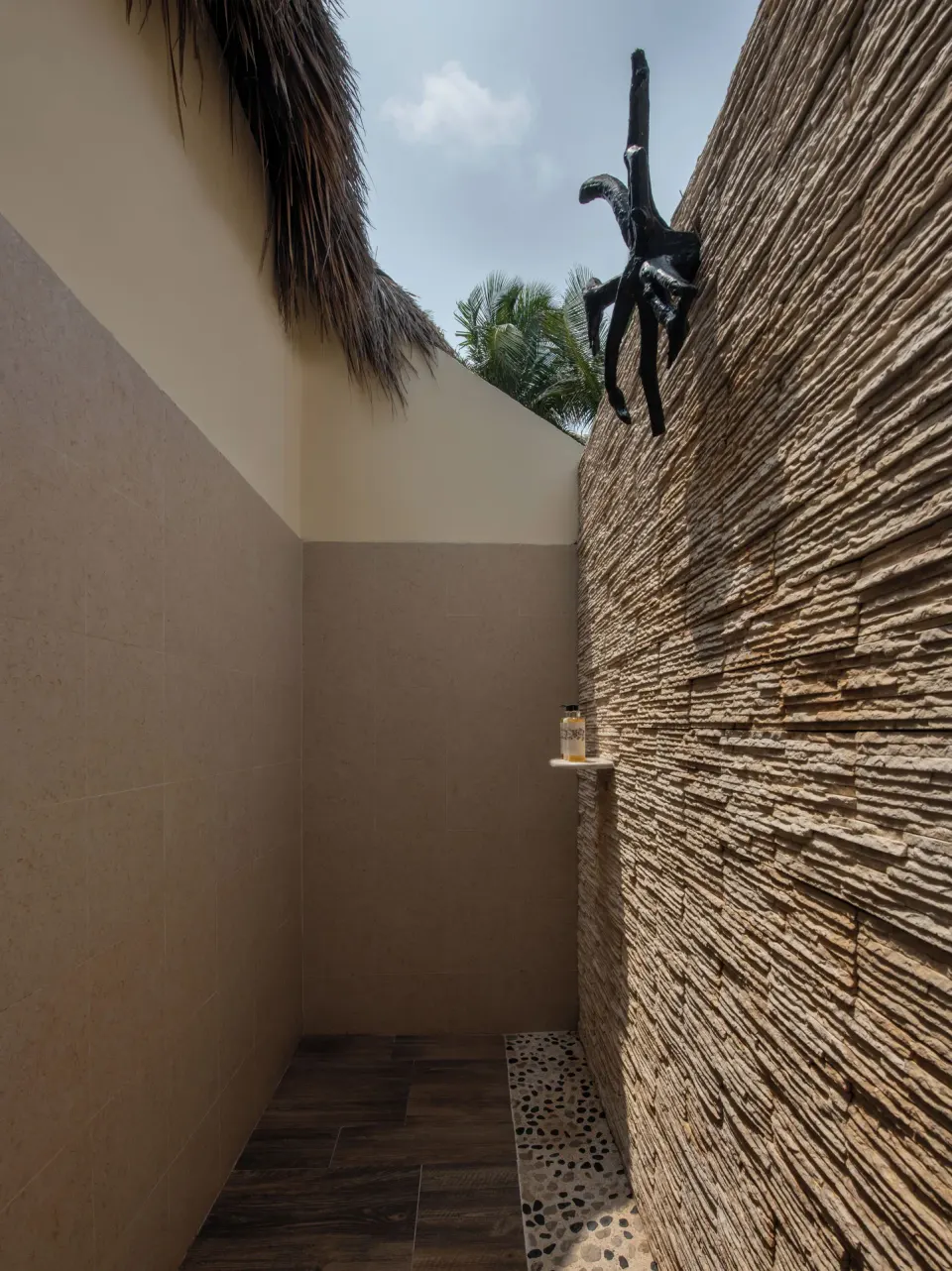 Casita Suite outdoor shower with textured wall at El Dorado Casitas Royale.