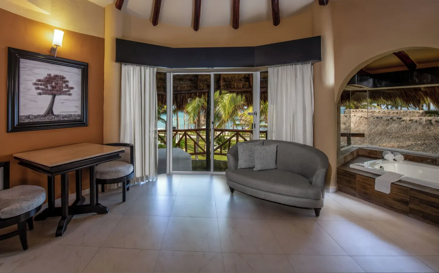 Casita Suite sitting area and balcony doors at El Dorado Casitas Royale.