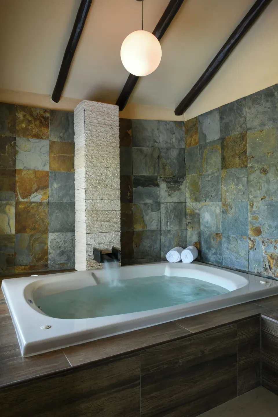 Private Pool Casita Suite indoor tub with stone walls at El Dorado Casitas Royale.
