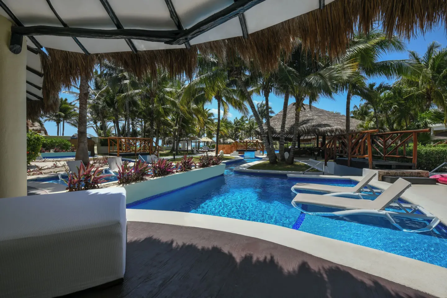 Royal Retreat Deluxe Swim Up Suite patio and pool area at El Dorado Casitas Royale.