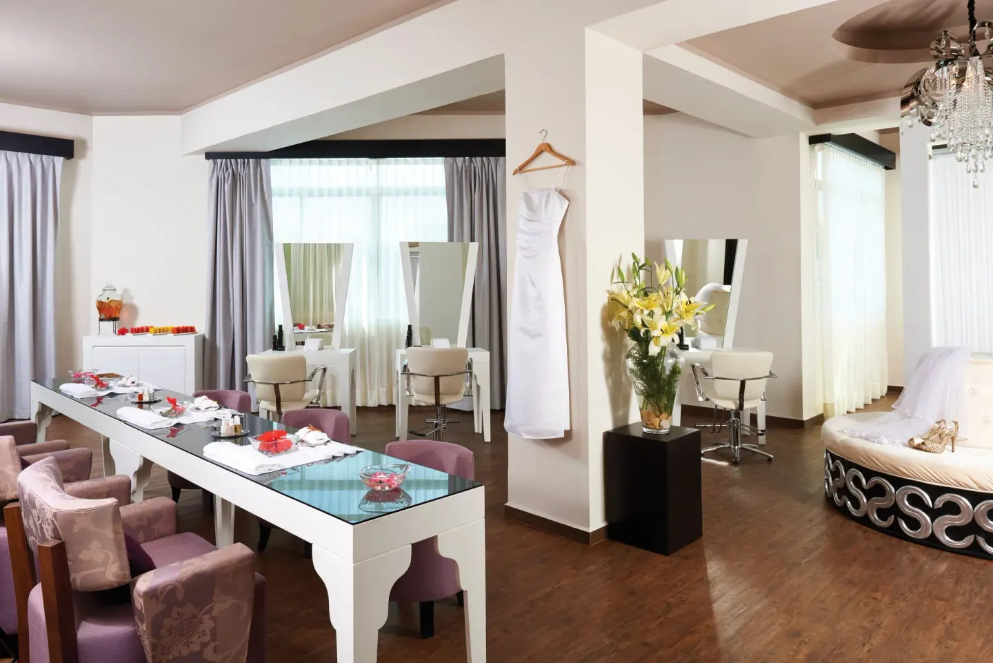 Bridal dressing suite with salon stations and gown display at El Dorado Casitas Royale.