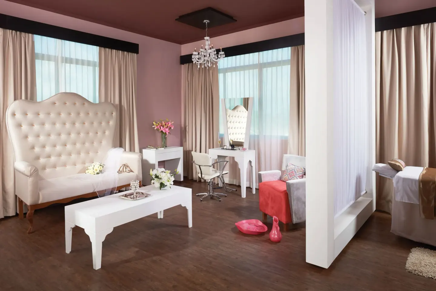 Bridal suite with tufted loveseat, vanity, and treatment bed at El Dorado Casitas Royale.