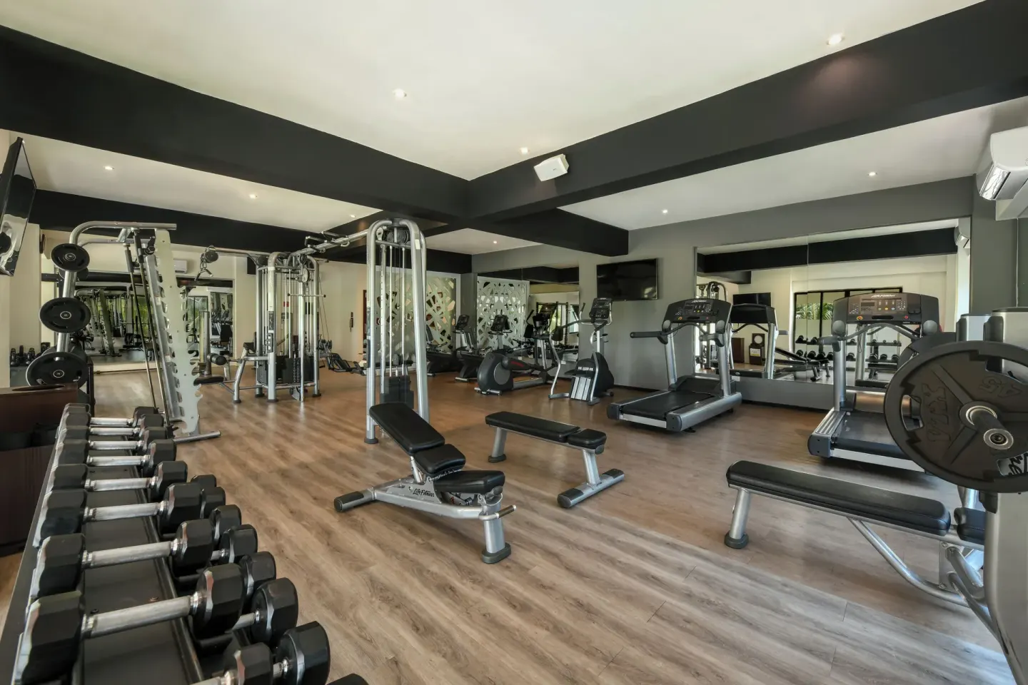 Fitness center with treadmills and weights at El Dorado Maroma Cenote, Underground Expedition.