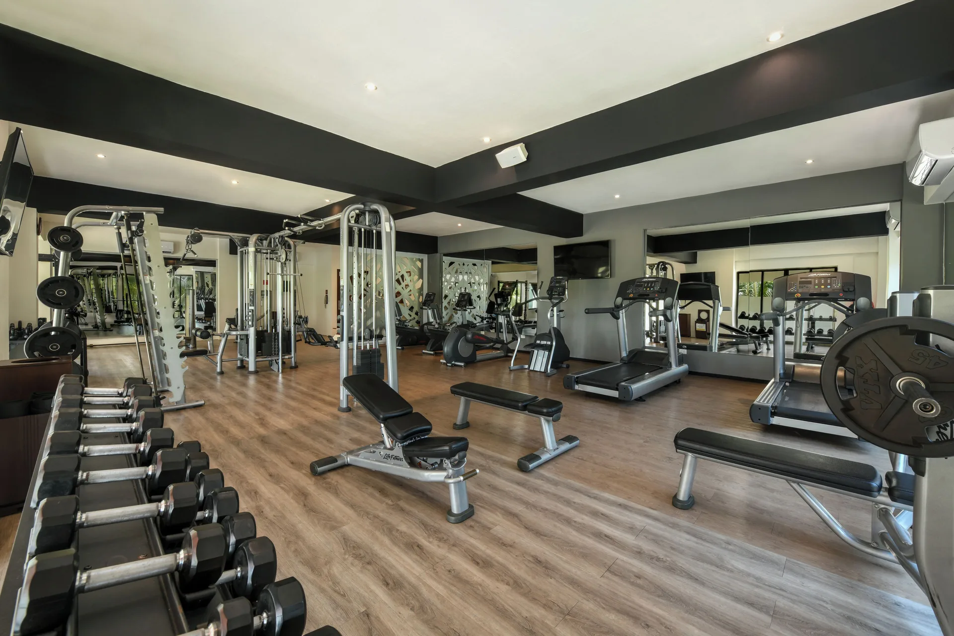 Fitness center with treadmills and weights at El Dorado Maroma Cenote, Underground Expedition.