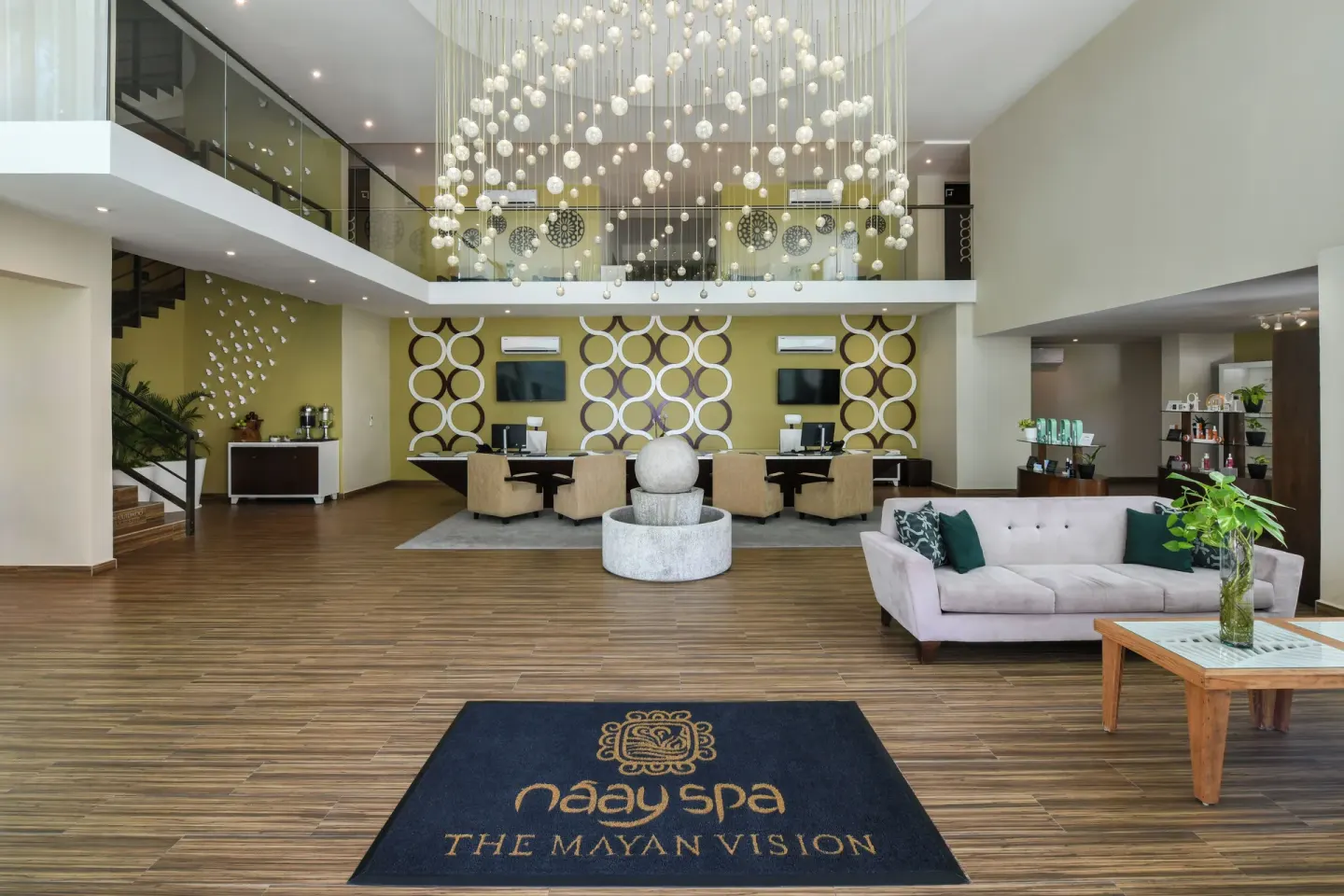 Spa reception lobby with chandelier at El Dorado Maroma Cenote, Underground Expedition.