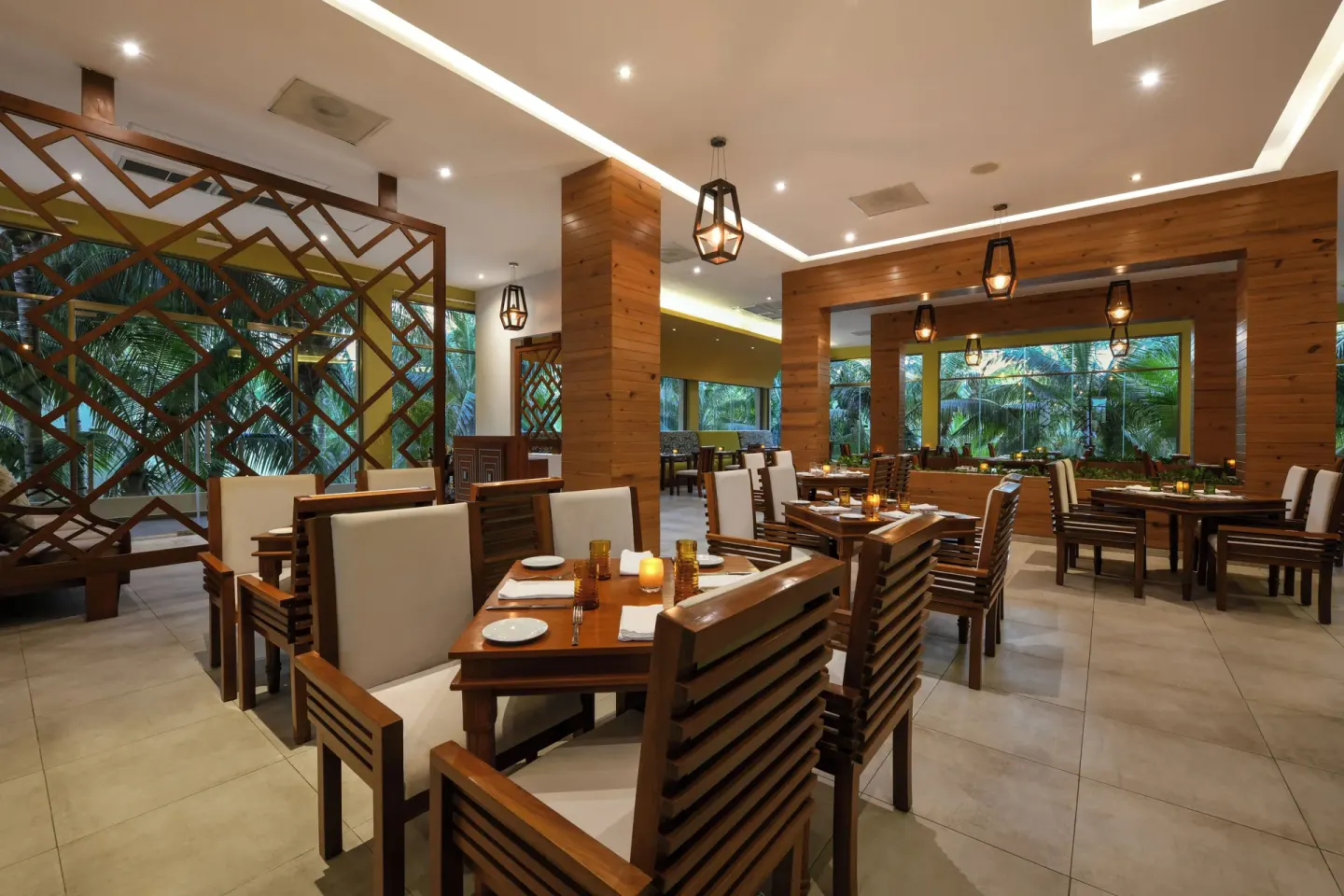 Modern wood-accented dining room at El Dorado Maroma Cenote, Underground Expedition.