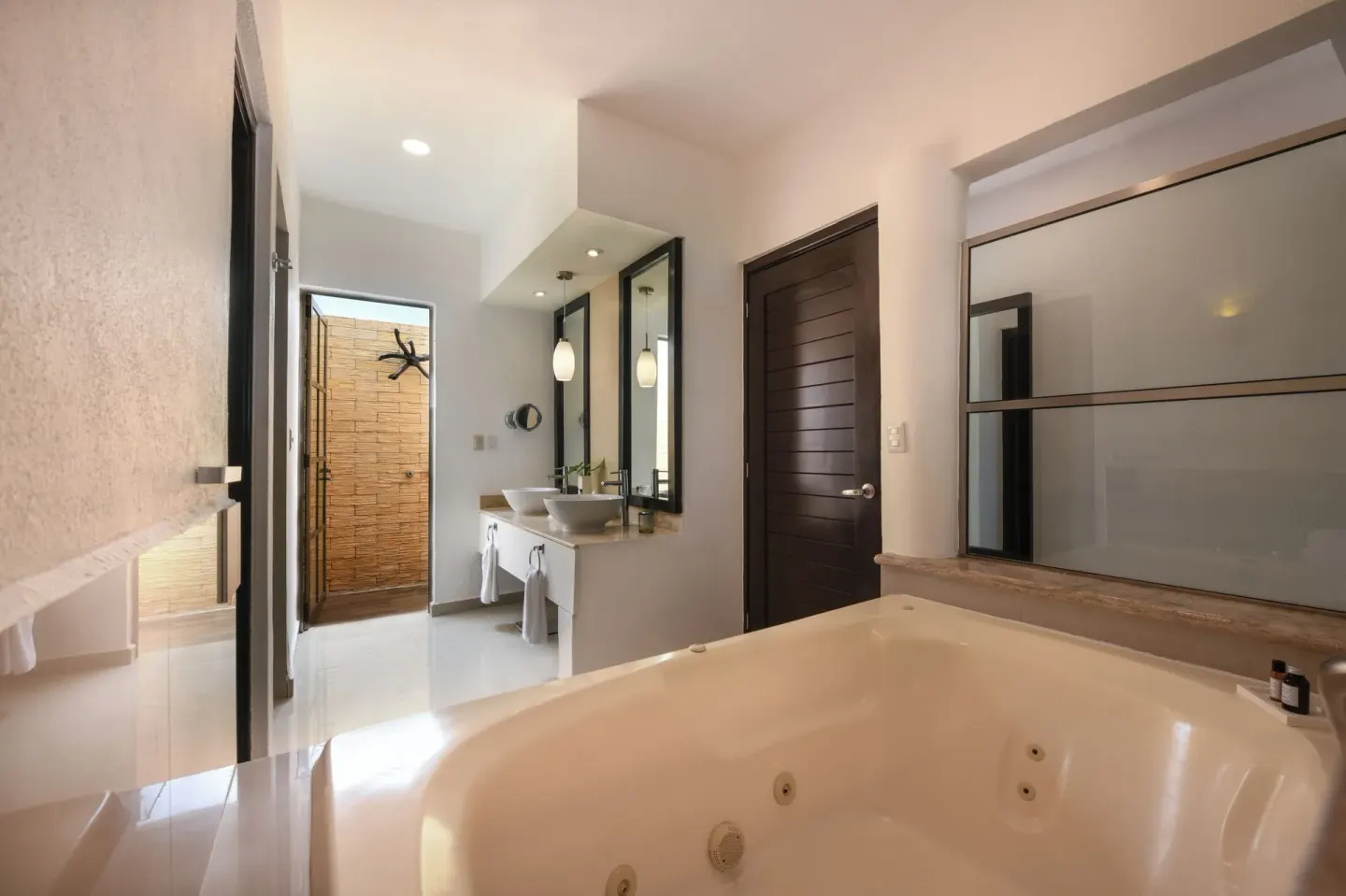 Honeymoon Suite bathroom with jetted tub at El Dorado Maroma Cenote, Underground Expedition.