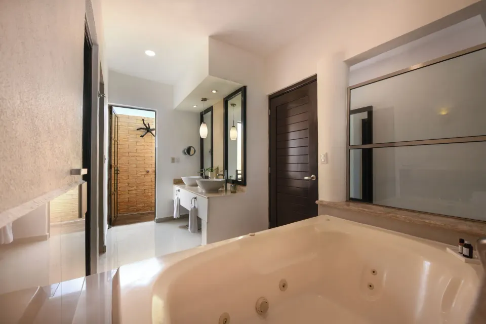 Honeymoon Suite bathroom with jetted tub at El Dorado Maroma Cenote, Underground Expedition.