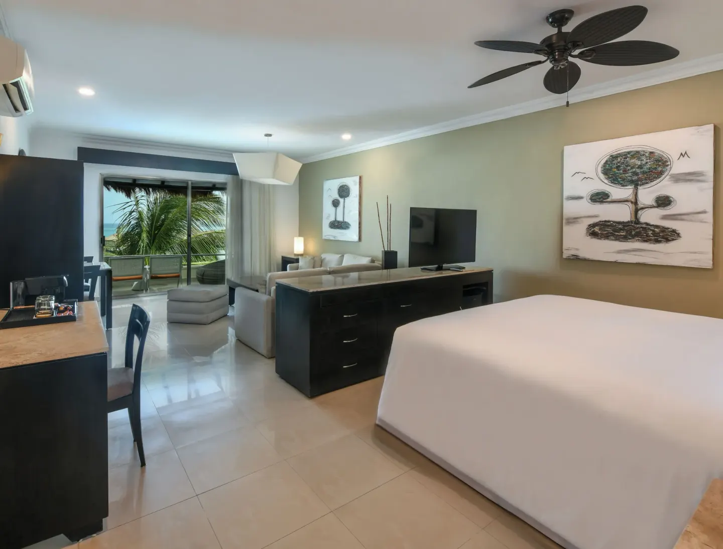 Honeymoon Suite bedroom and sitting area at El Dorado Maroma Cenote, Underground Expedition.