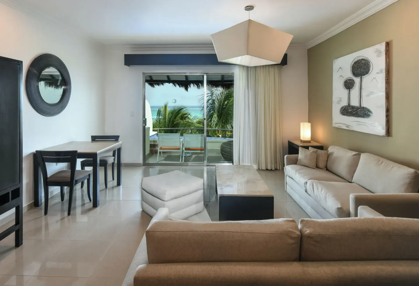 Honeymoon Suite living area with balcony view at El Dorado Maroma Cenote, Underground Expedition.