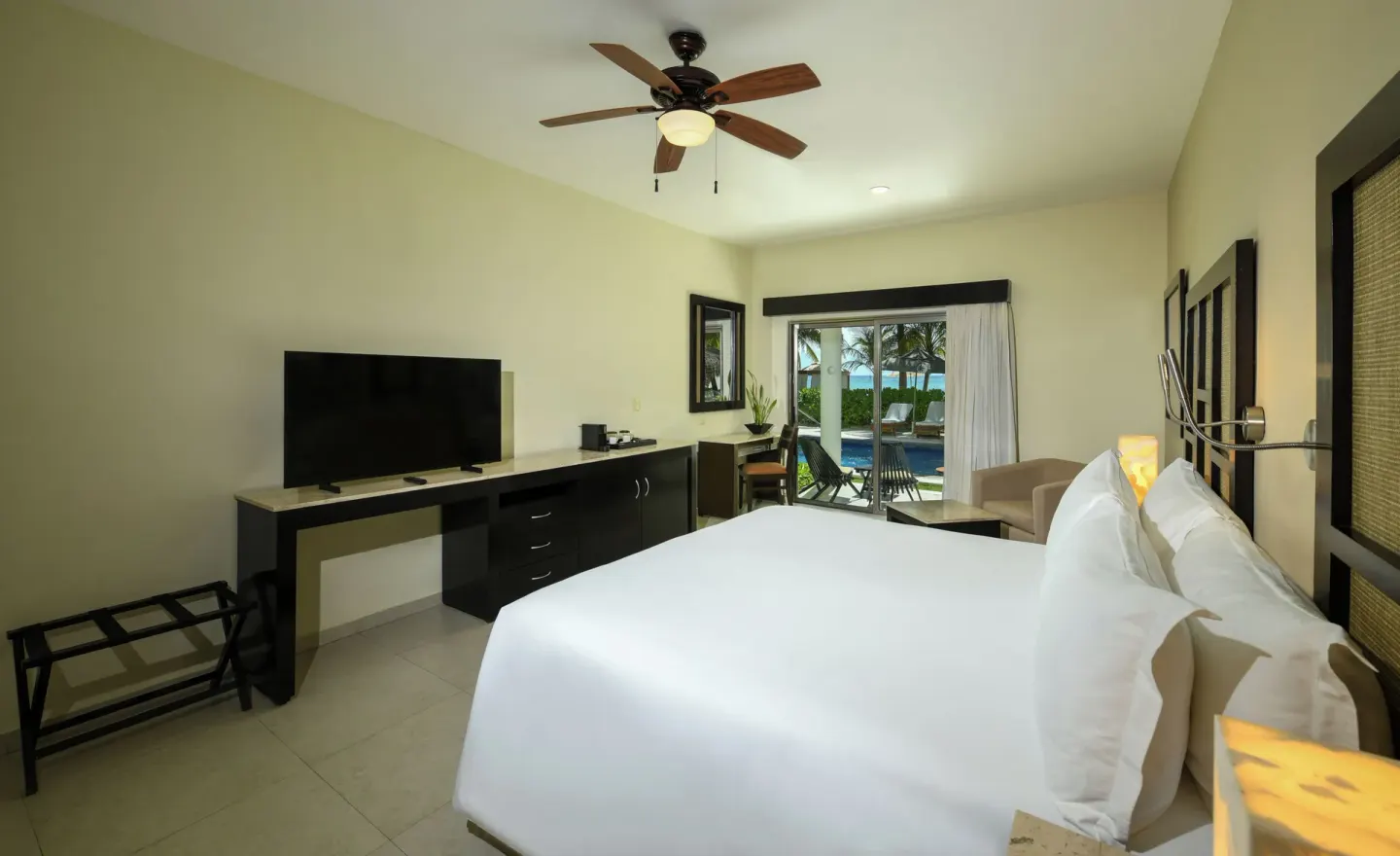 Royal Retreat Haven Suite king bed and patio doors at El Dorado Maroma Cenote, Underground Expedition.