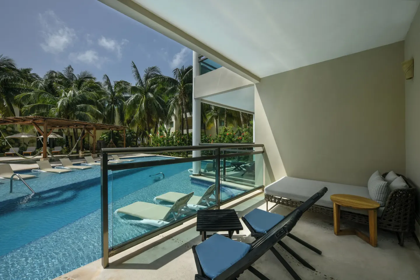 Swim Up Suite balcony with pool view at El Dorado Maroma Cenote, Underground Expedition.