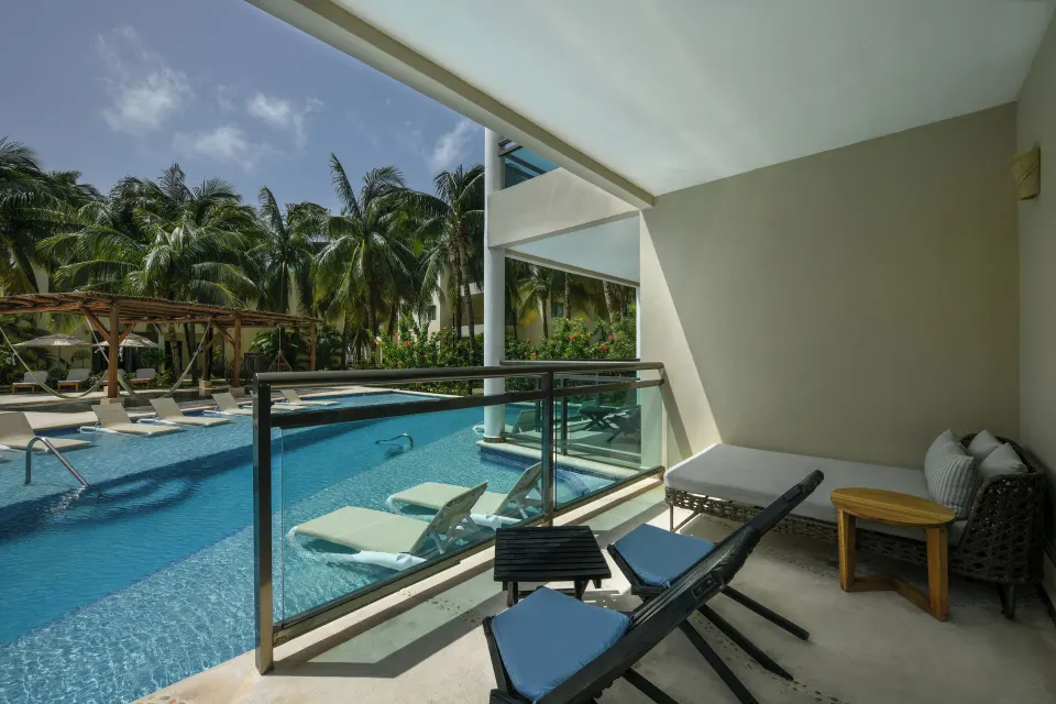 Swim Up Suite balcony with pool view at El Dorado Maroma Cenote, Underground Expedition.