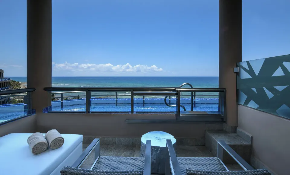 Private balcony with plunge pool and ocean view at El Dorado Seaside Suites