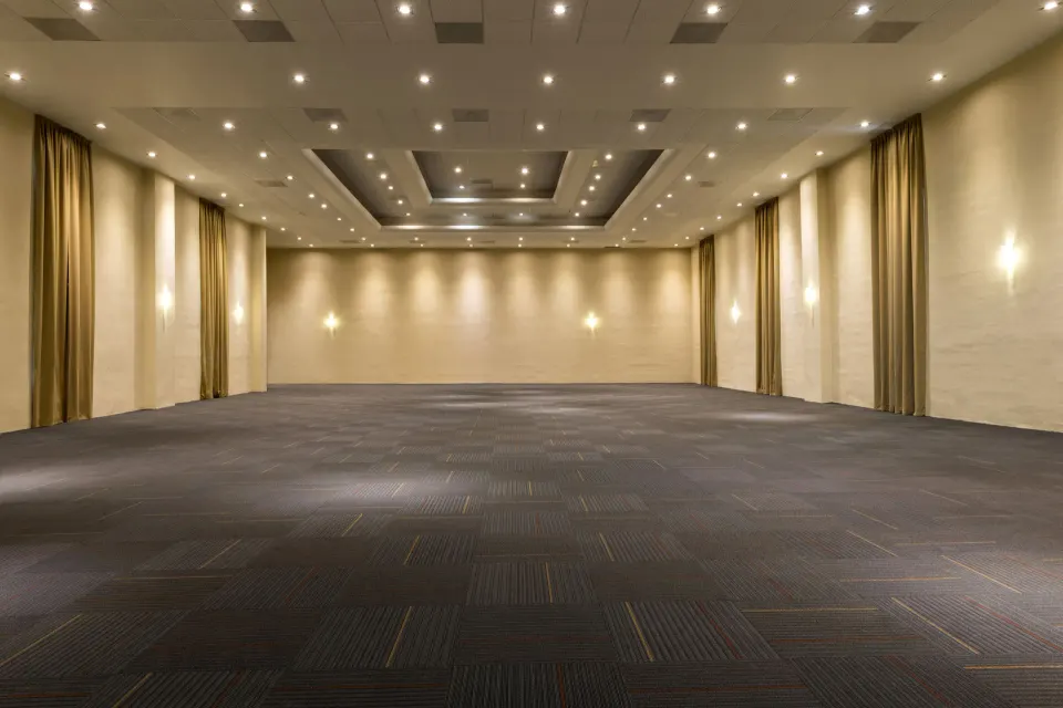 Large empty event ballroom with recessed lighting at El Dorado Seaside Suites