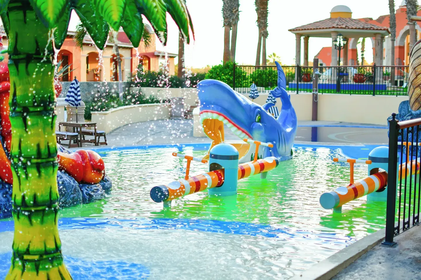Children's splash pool with colorful whale play feature at El Encanto at Hacienda Encantada.