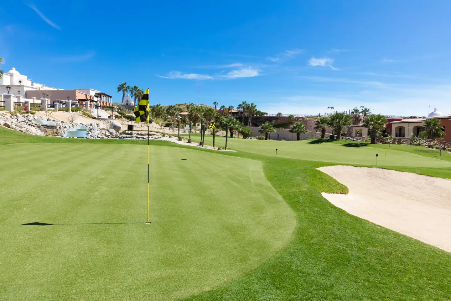 Golf putting green and sand bunker at El Encanto at Hacienda Encantada