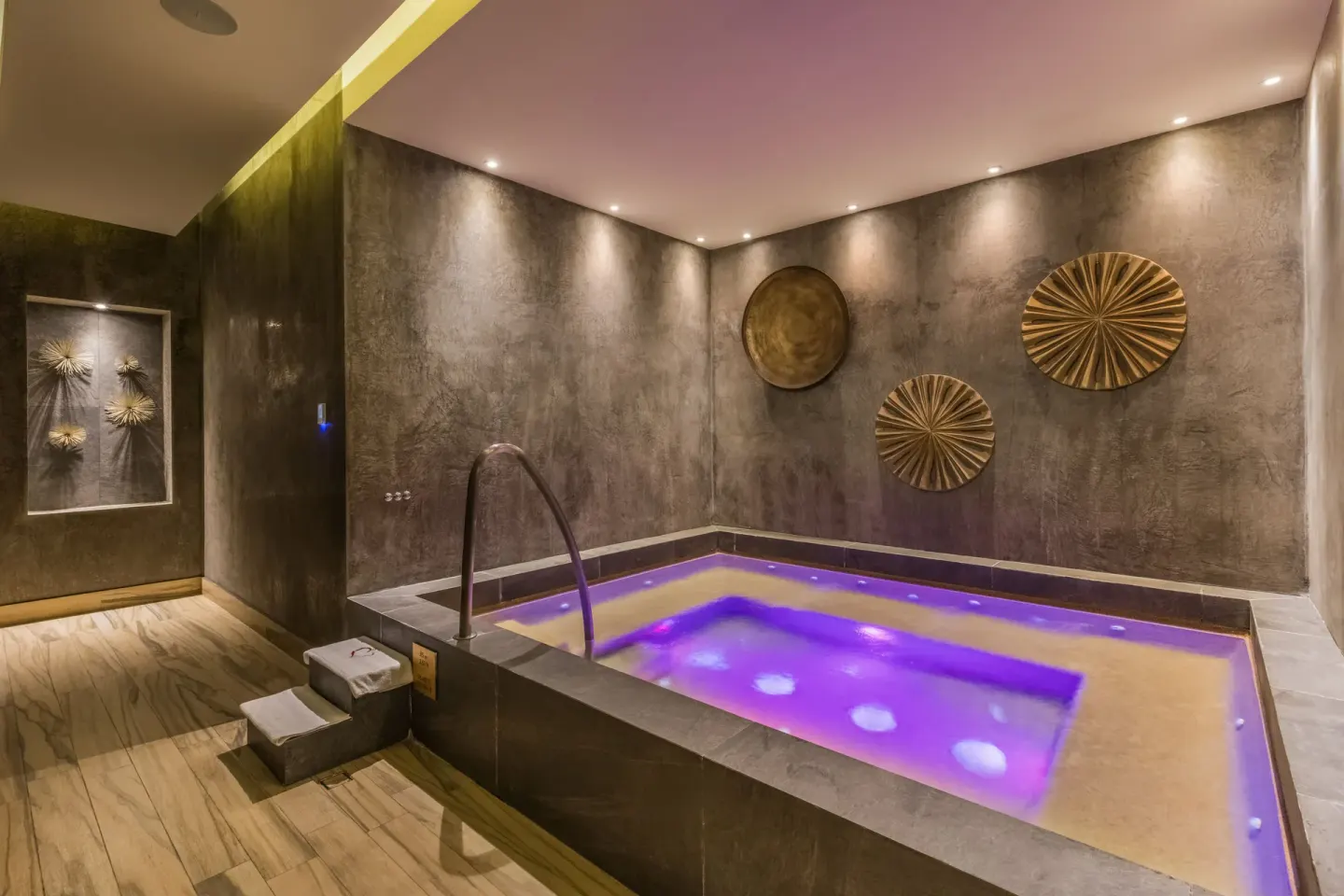 Indoor whirlpool with purple lighting at El Encanto at Hacienda Encantada