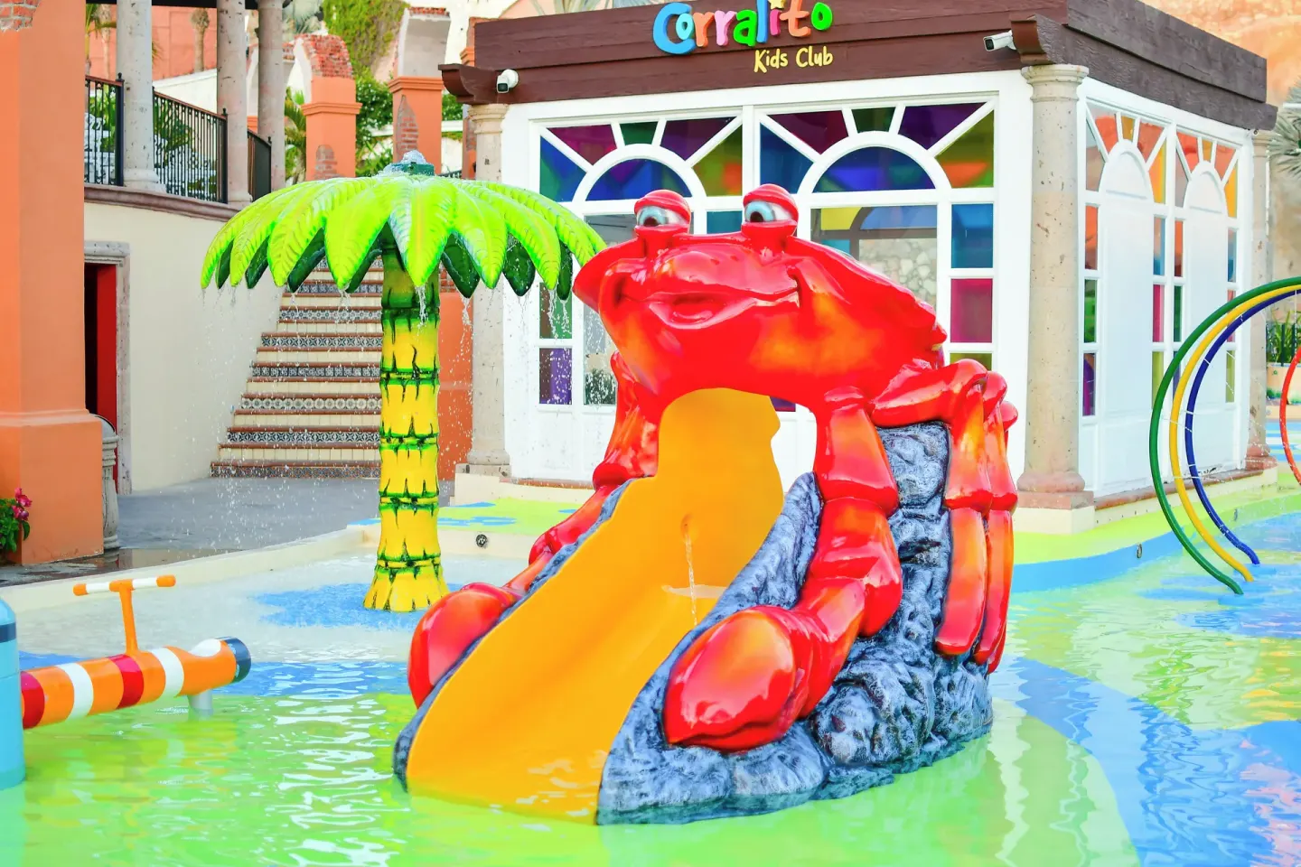 Kids splash area with crab slide and water features at El Encanto at Hacienda Encantada.