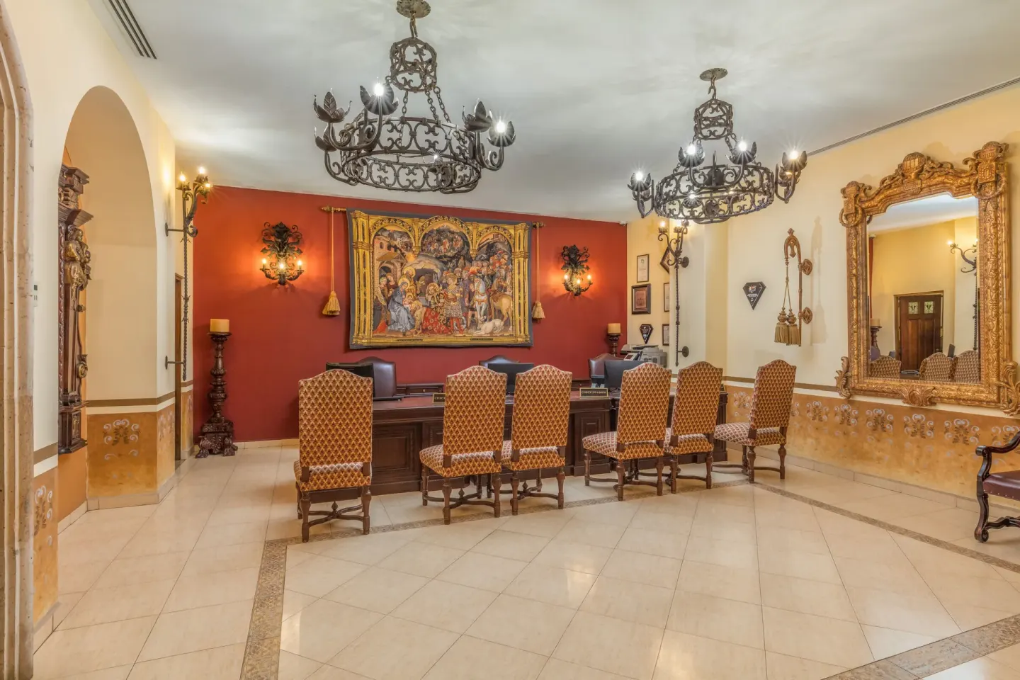 Reception desk with chandeliers and ornate decor at El Encanto at Hacienda Encantada.