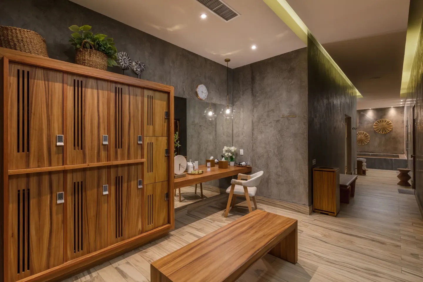 Spa locker area with wood lockers and vanity at El Encanto at Hacienda Encantada